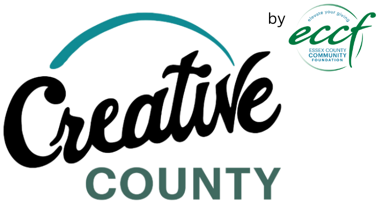 Logo for Creative County, featuring stylized text and a curved arch design.