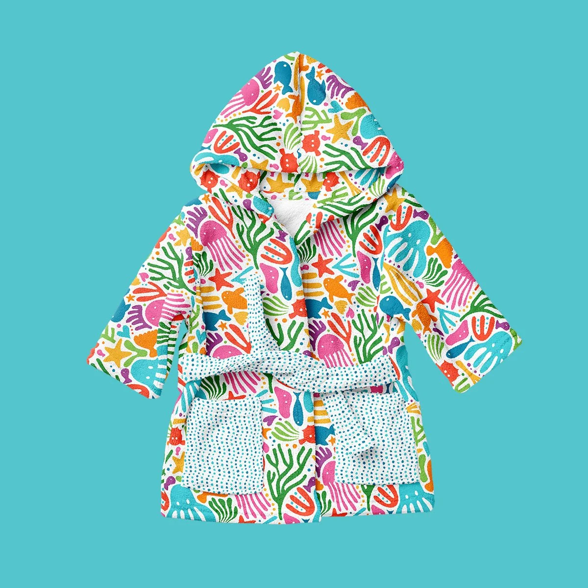 Colorful hooded bathrobe with underwater sea creatures and coral pattern on a blue background.
