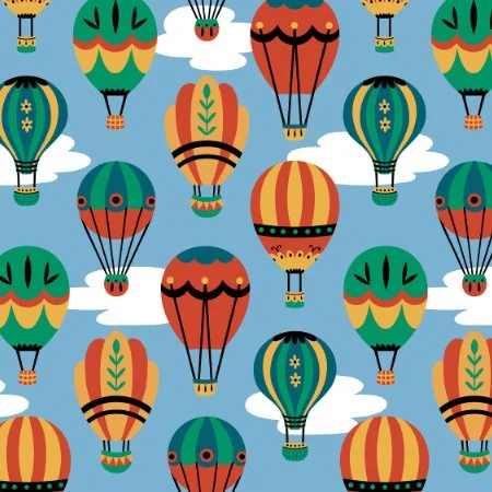 Pattern of colorful hot air balloons floating among white clouds on a blue sky background.