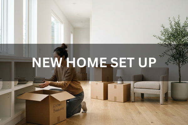 Person unpacking boxes and setting up their new home after moving.