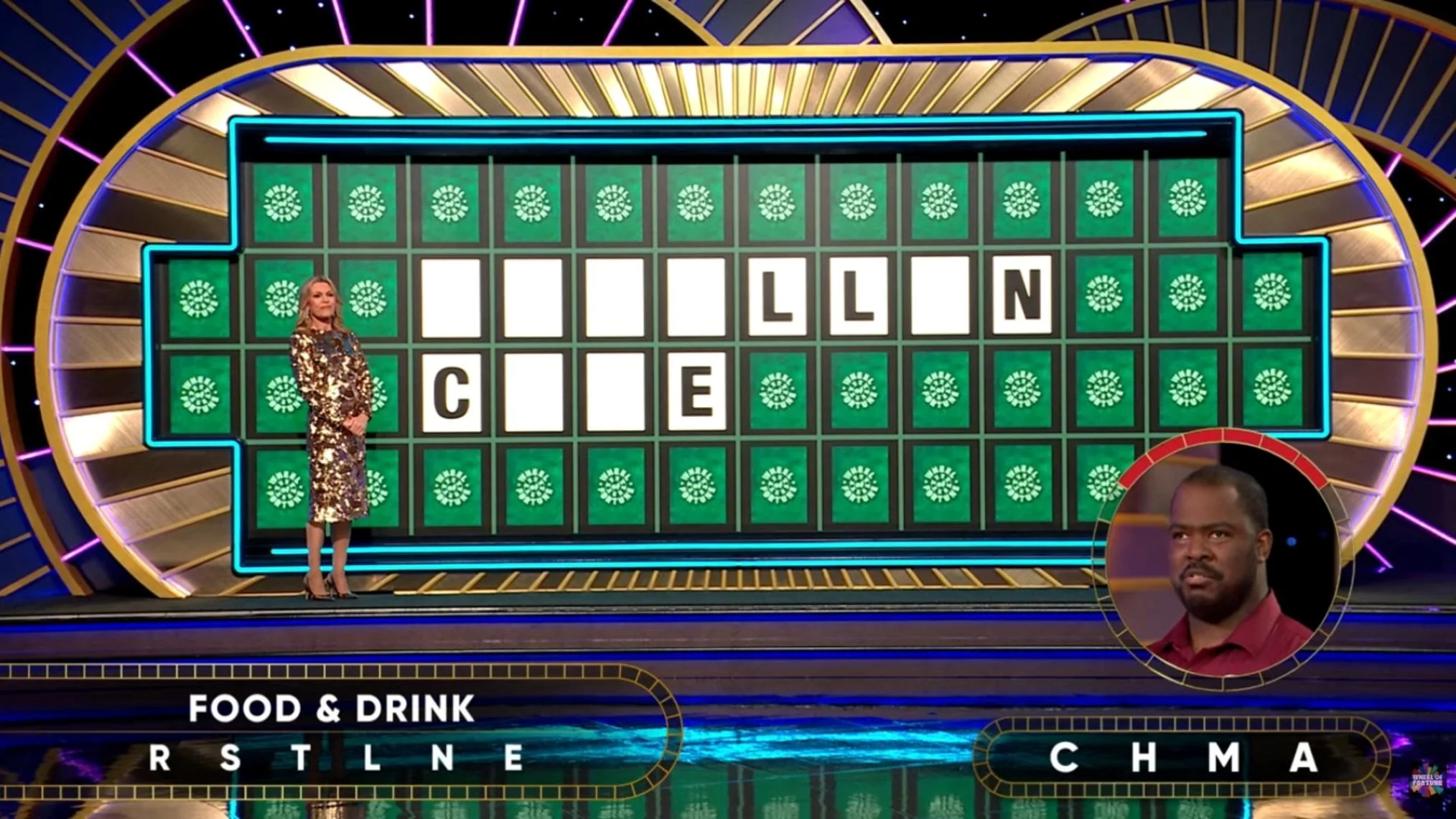 Television game show scene with a woman standing next to a large puzzle board displaying the partially solved phrase 'I' 'LL' 'C' 'E' 'LIN' 'CH' and a circle of squares for letters. A man is visible in an inset circle, and a labeled category 'Food & Drink' at the bottom with blank spaces for letters.