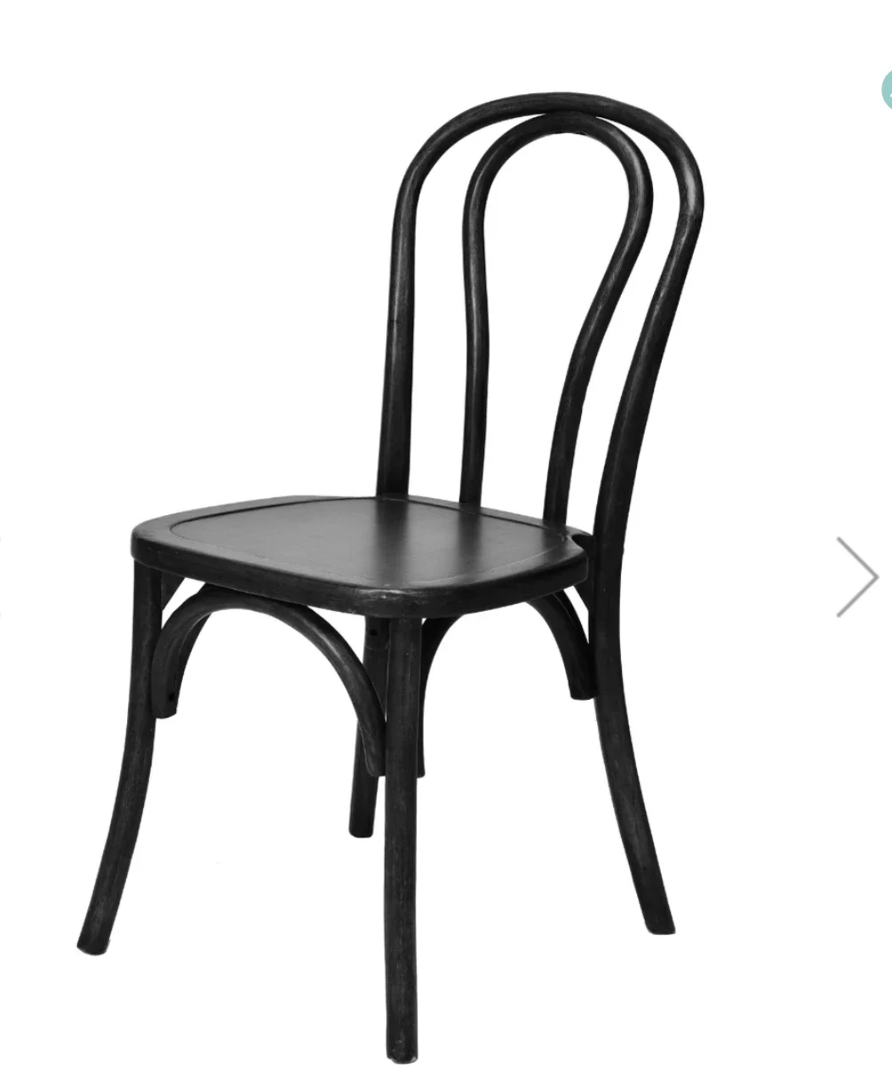 Black wooden chair with four legs, a curved backrest, and a flat seat, isolated on white background.