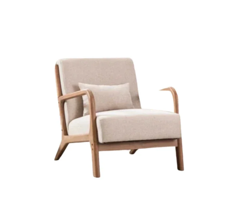 A beige upholstered armchair with wooden frame and a small pillow, isolated on a white background.