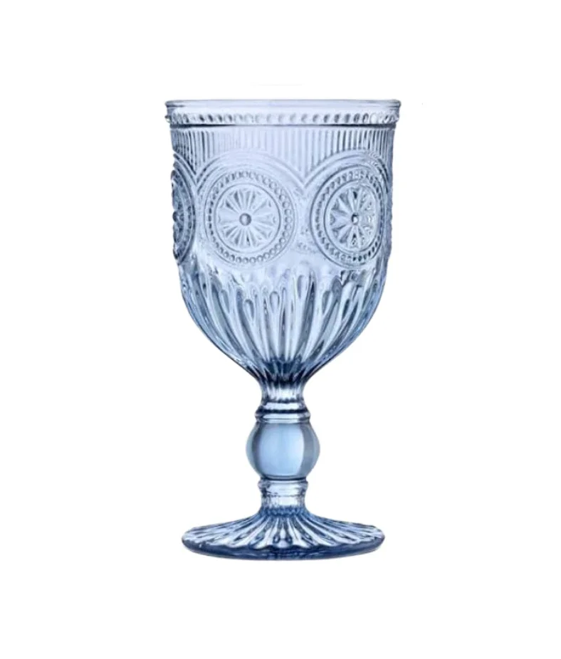 A clear glass goblet with intricate patterns and designs, standing upright on a white background.