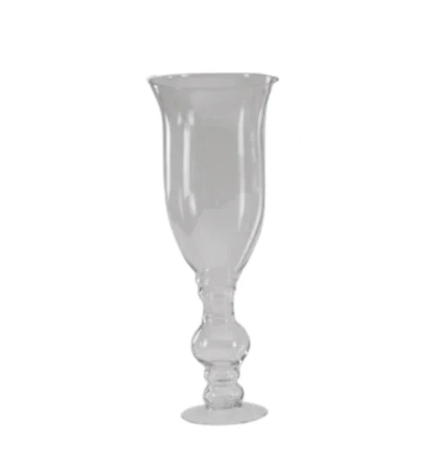 A clear glass chalice with a decorative stem