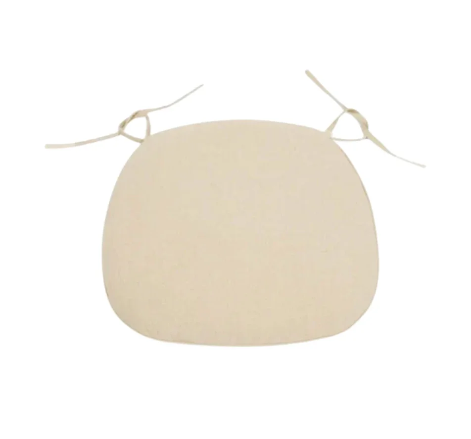 A beige, rounded object with tied ribbons on each side, resembling a soft bag or pillow, against a white background.