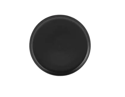 A black, round dish or plate seen from above.