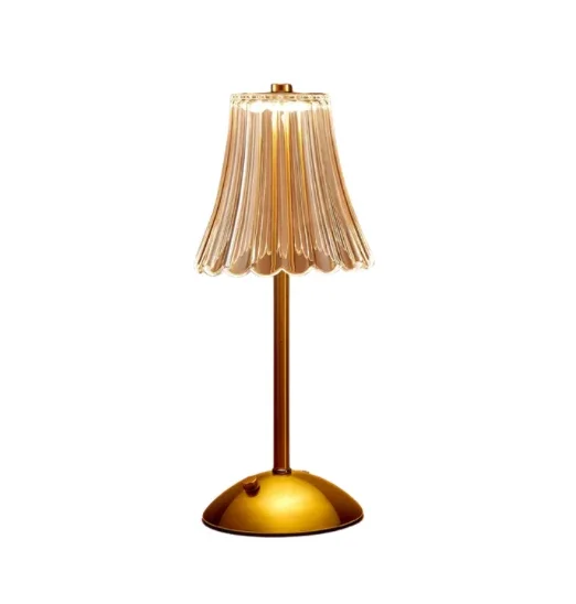A vintage-style table lamp with a gold base, a slender gold stem, and a pleated beige lampshade.