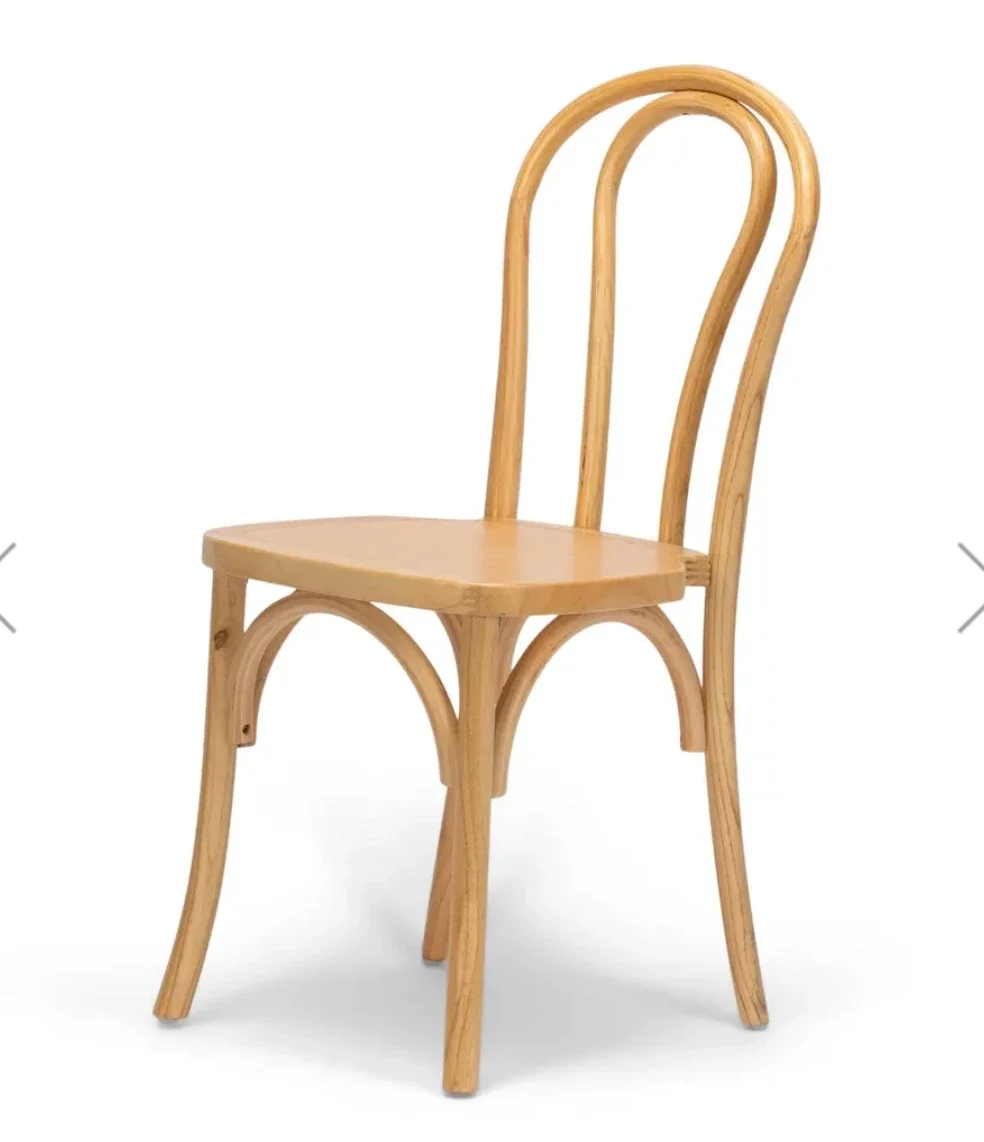 Wooden chair with curved backrest and four legs, front view.
