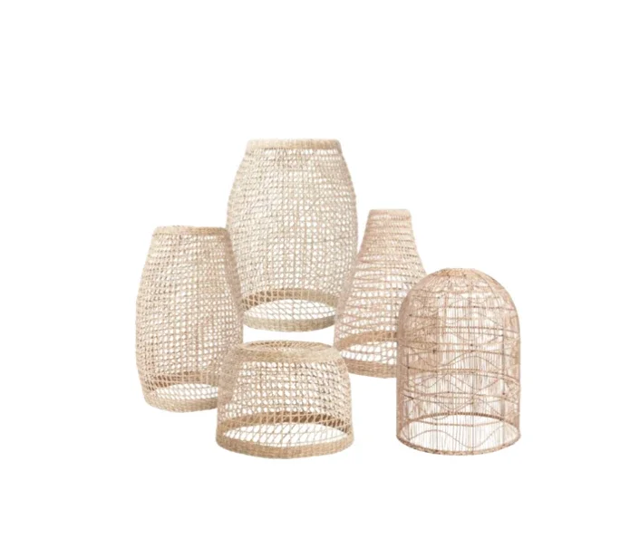 Set of five woven rattan lanterns with open lattice design in natural color, varying in sizes and shapes, against a white background.