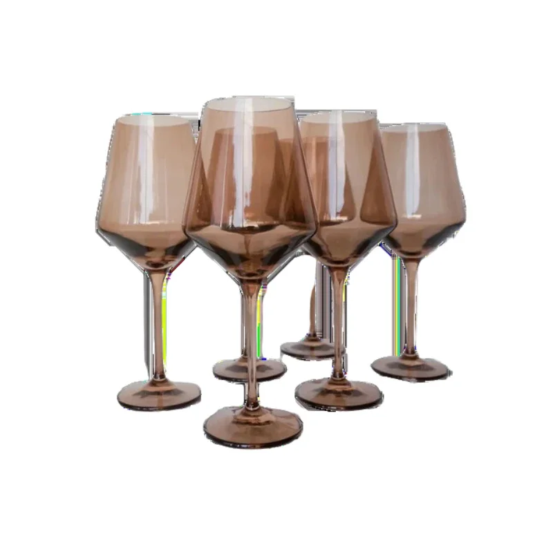 Five wine glasses filled with chocolate liquid, arranged in a group on a white background.