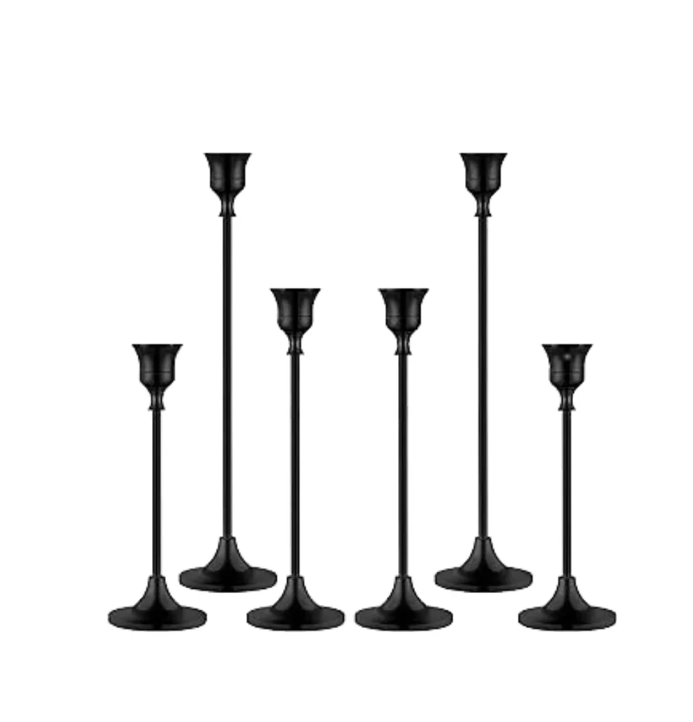 Set of six black outdoor lampposts of varying heights, arranged in a group on a white background.