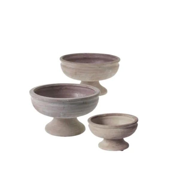 Three hanging ceramic bowls with pedestal bases in neutral tones.