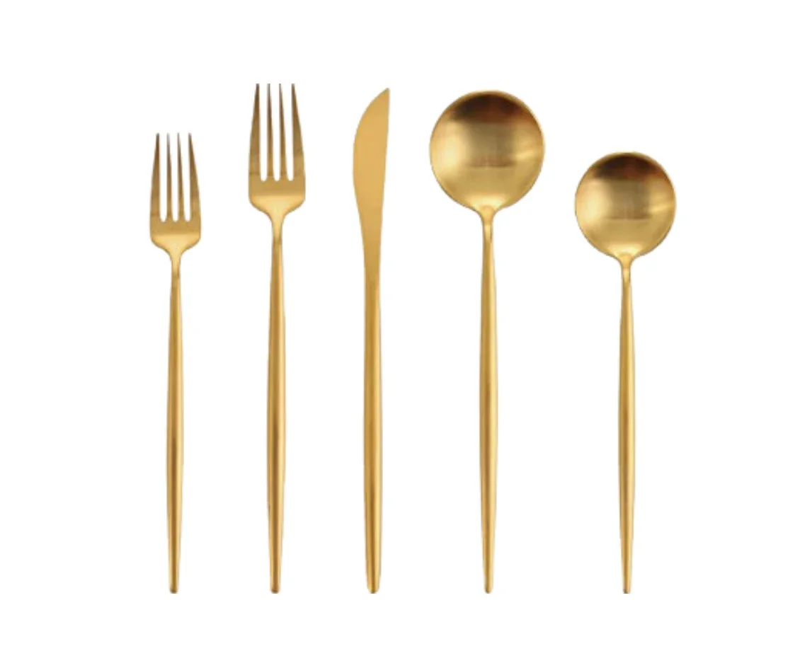 Set of five gold-colored utensils including two forks, one knife, and two spoons, against a white background.