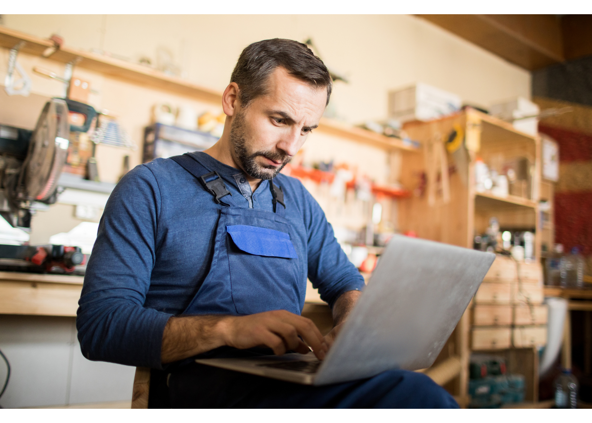 Fiber technician working on a laptop at a job site