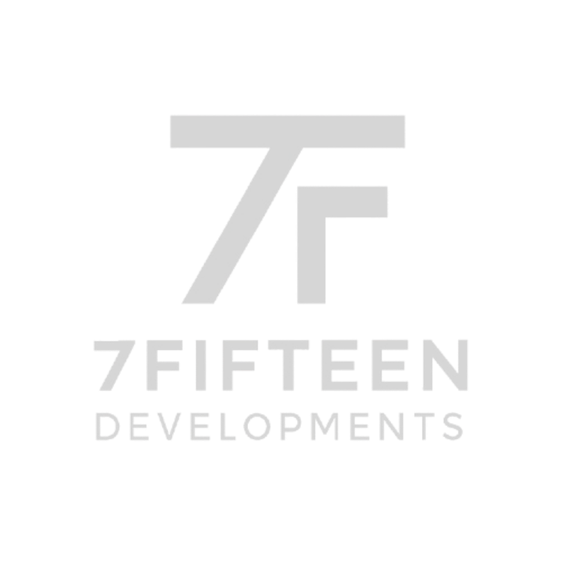 Logo of 7FIFTEEN DEVELOPMENTS featuring a stylized number seven and the word 'seven' below, on a black background.