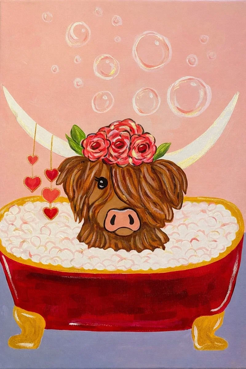 A cute illustration of a Highland cow with long, brown fur and a pink flower crown, sitting in a red bathtub filled with white bubbles. The cow has a pink nose and one eye visible. Behind it, there is a light pink background with sparkling bubbles and hanging red hearts.