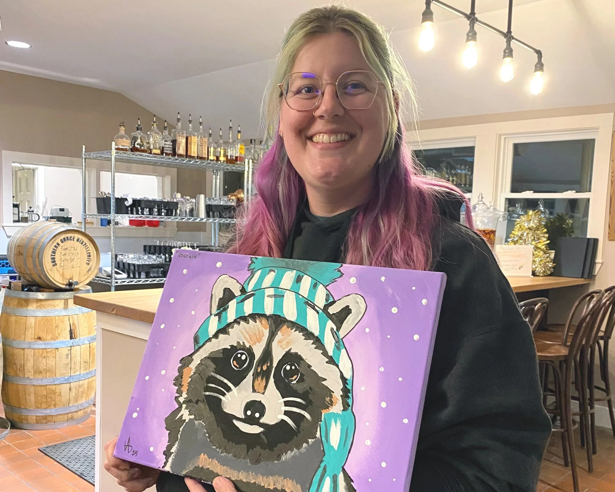paint party guest with raccoon painting