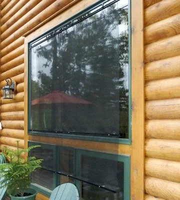 Exterior window screens applied to cottage window exterior to prevent birds from hitting windows
