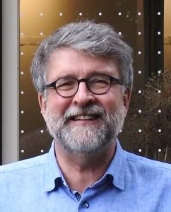 Smiling headshot of John Robert Carley, FLAP Canada
