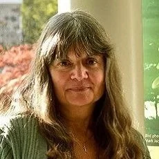 Smiling photo of Paloma Plant, retired staff of FLAP Canada