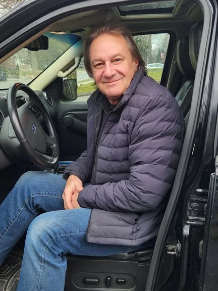 Volunteer Driver sitting in his car.