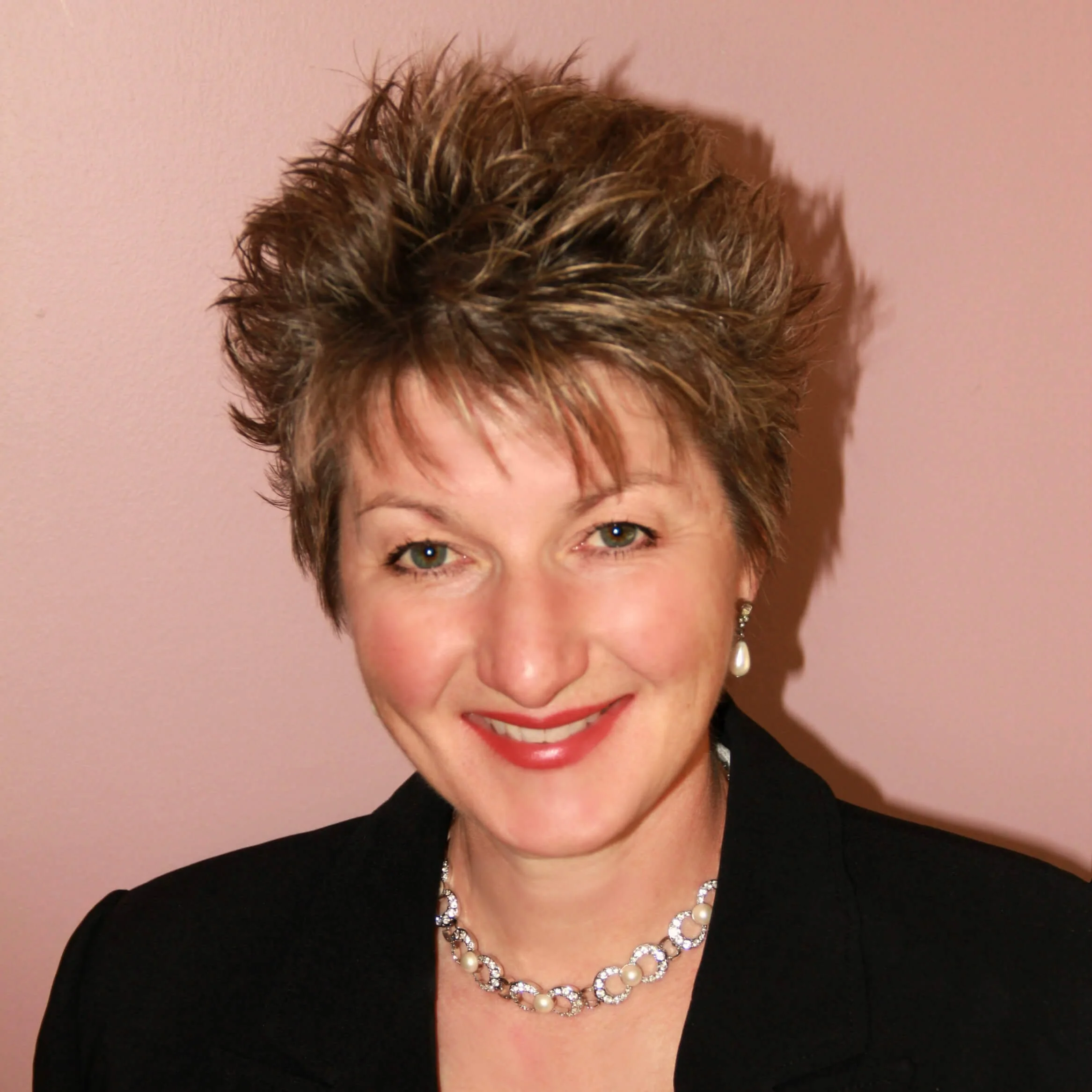 Smiling headshot of Lea M. Ray, FLAP Canada