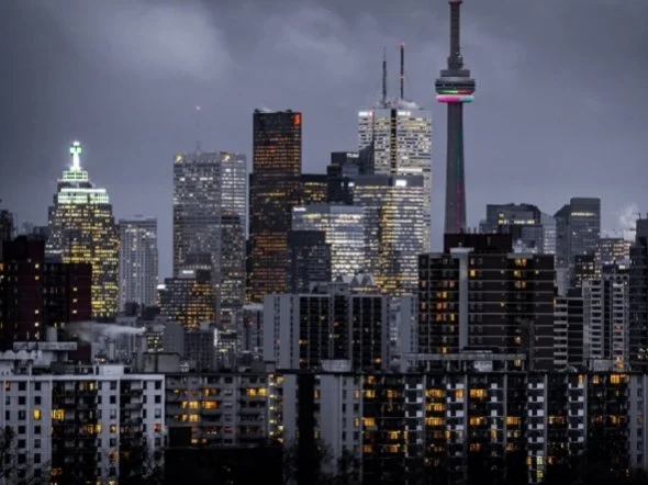 Toronto downtown buildings lit up at night, showing how dangerous lights at night in buildings are to migrating birds