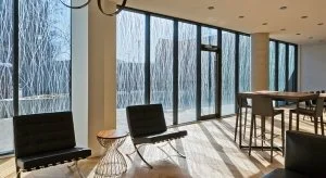 Interior shot looking out through windows with acid-etched patterns for bird-friendly solution