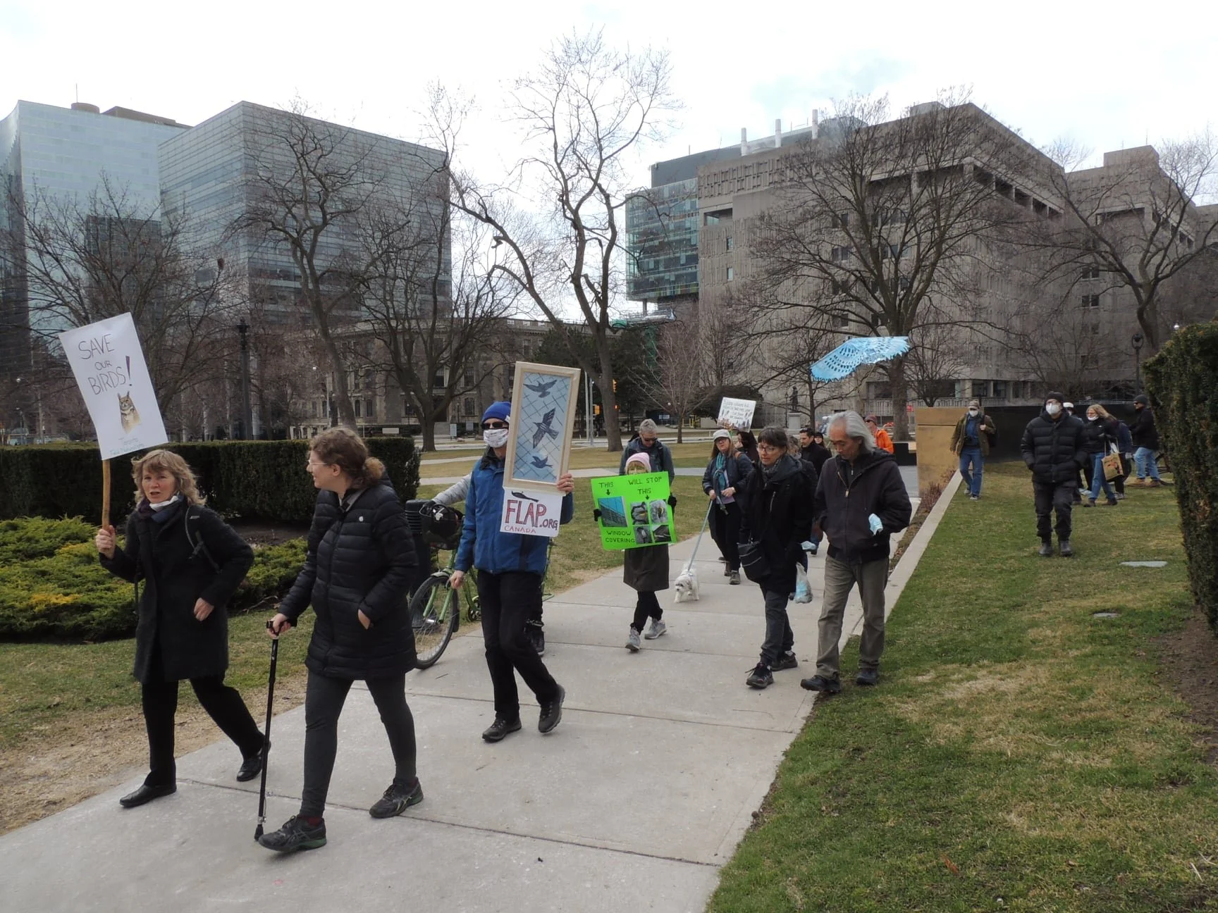 FLAP Canada volunteers rally at Queen's Park to advocate for bird-safe windows in order to save birds in Ontario