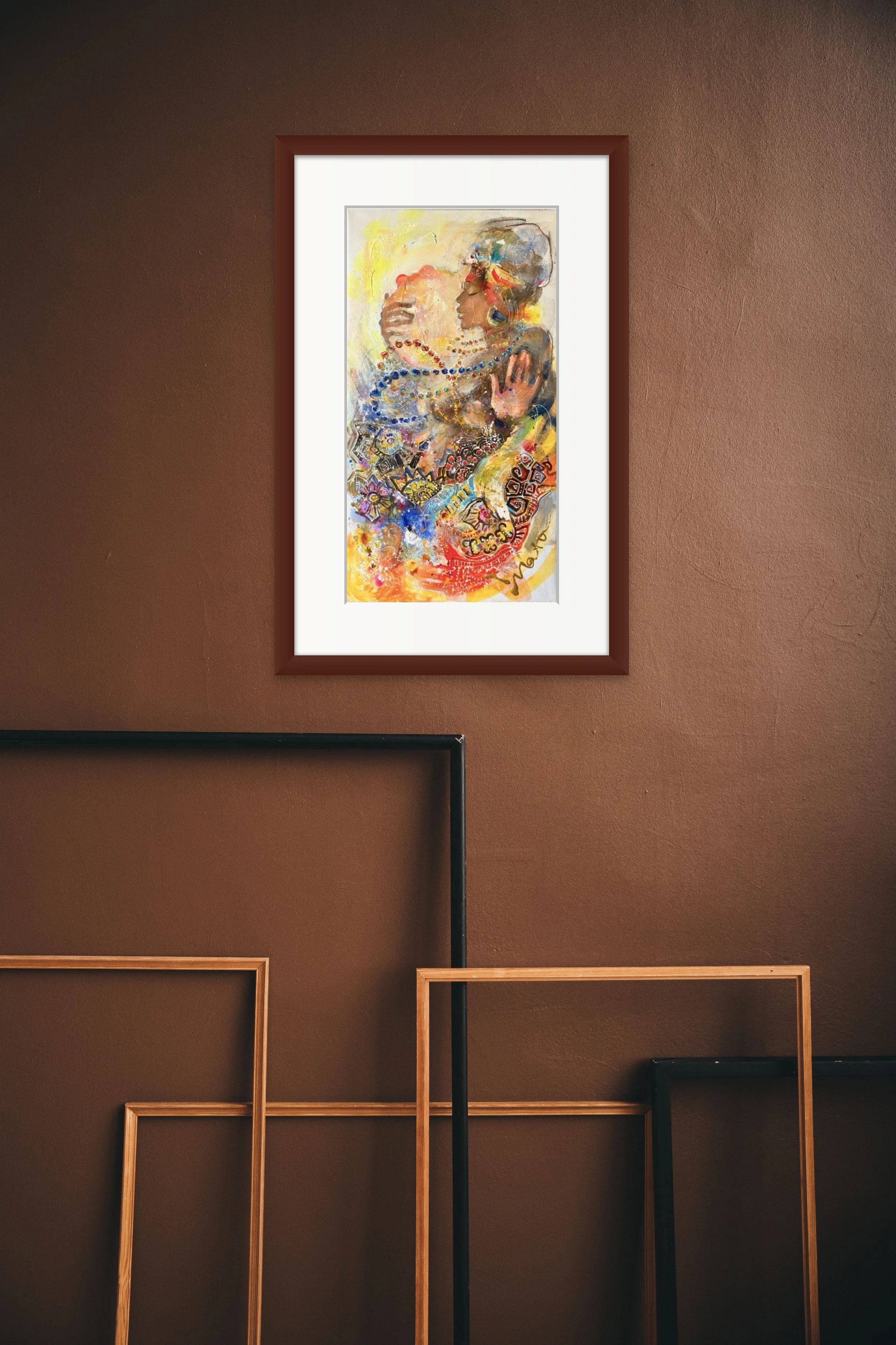 Colorful abstract portrait of a woman with jewelry, glasses, and a head covering, displayed in a wooden frame on a brown wall.