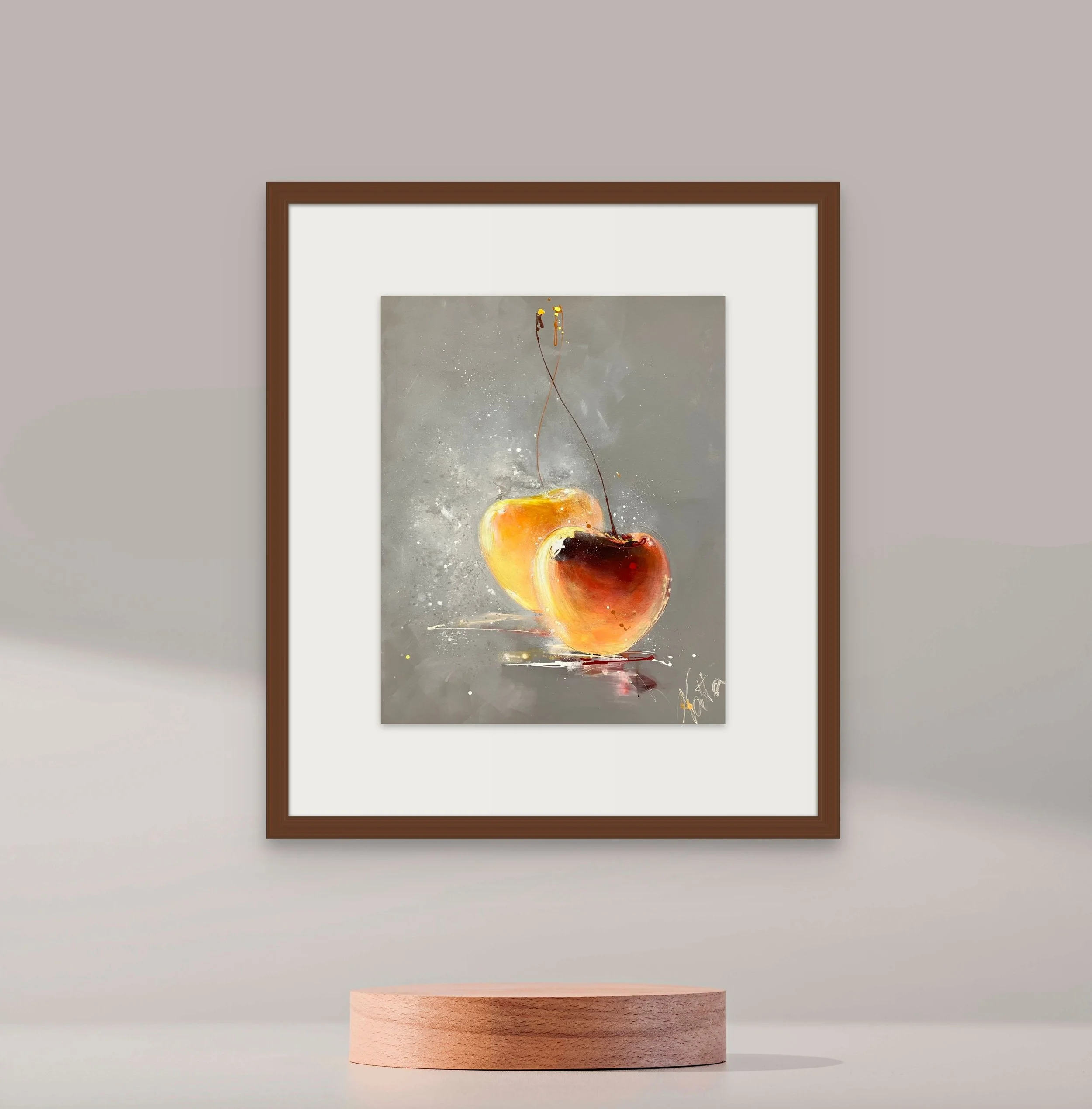 Framed abstract painting of two cherries with a gray background, on a pedestal in front of a light-colored wall.