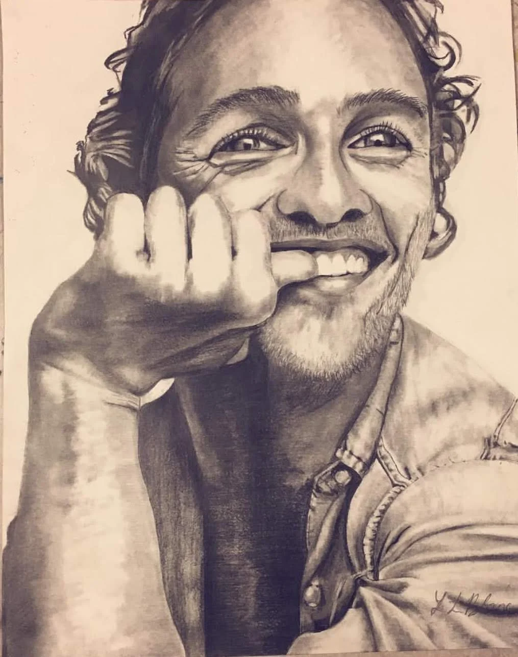 Realistic portrait drawing of a smiling man, original pencil art by Leah LeBlanc.