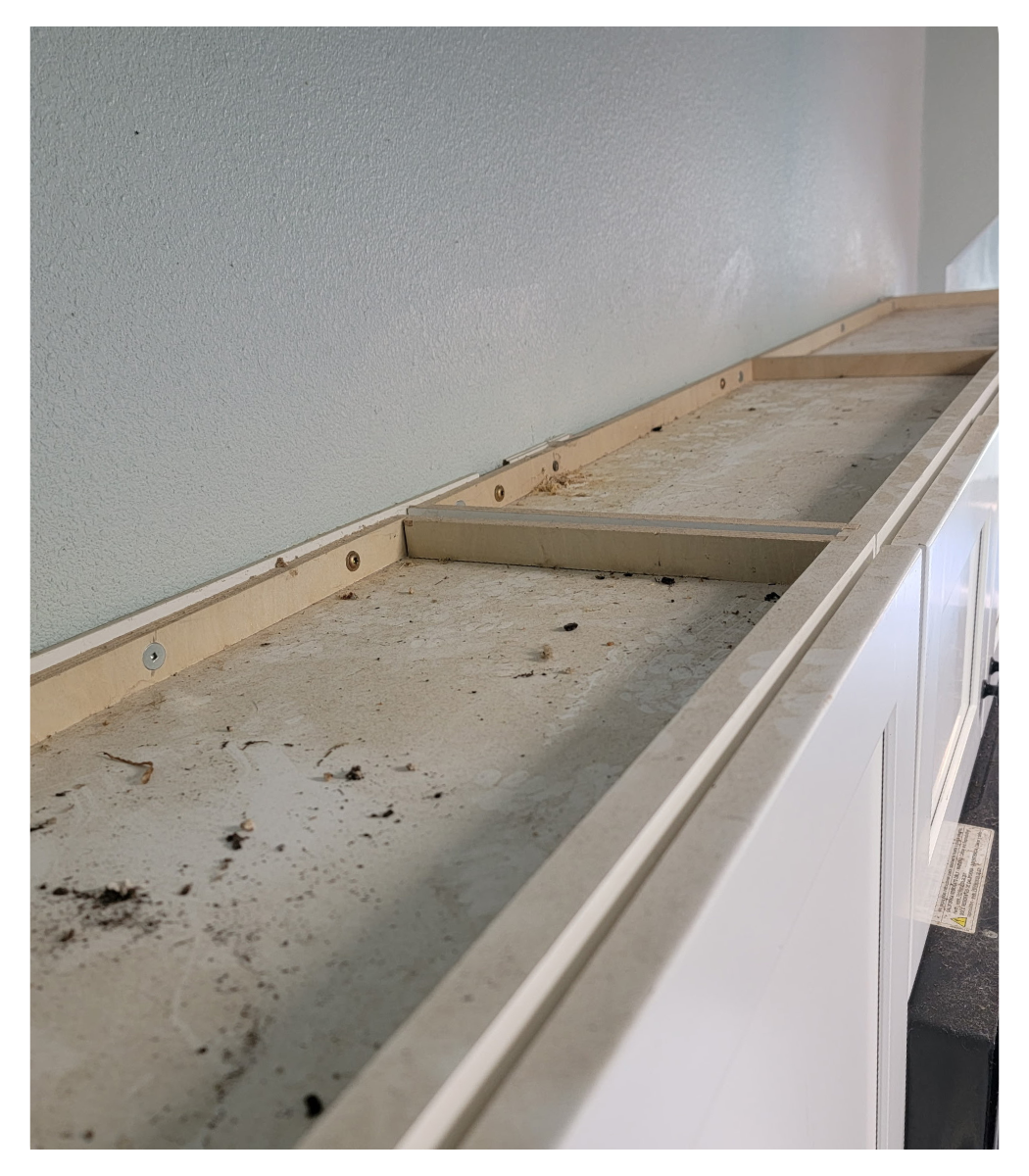 Before, the top of cabinets caked with dust and grease