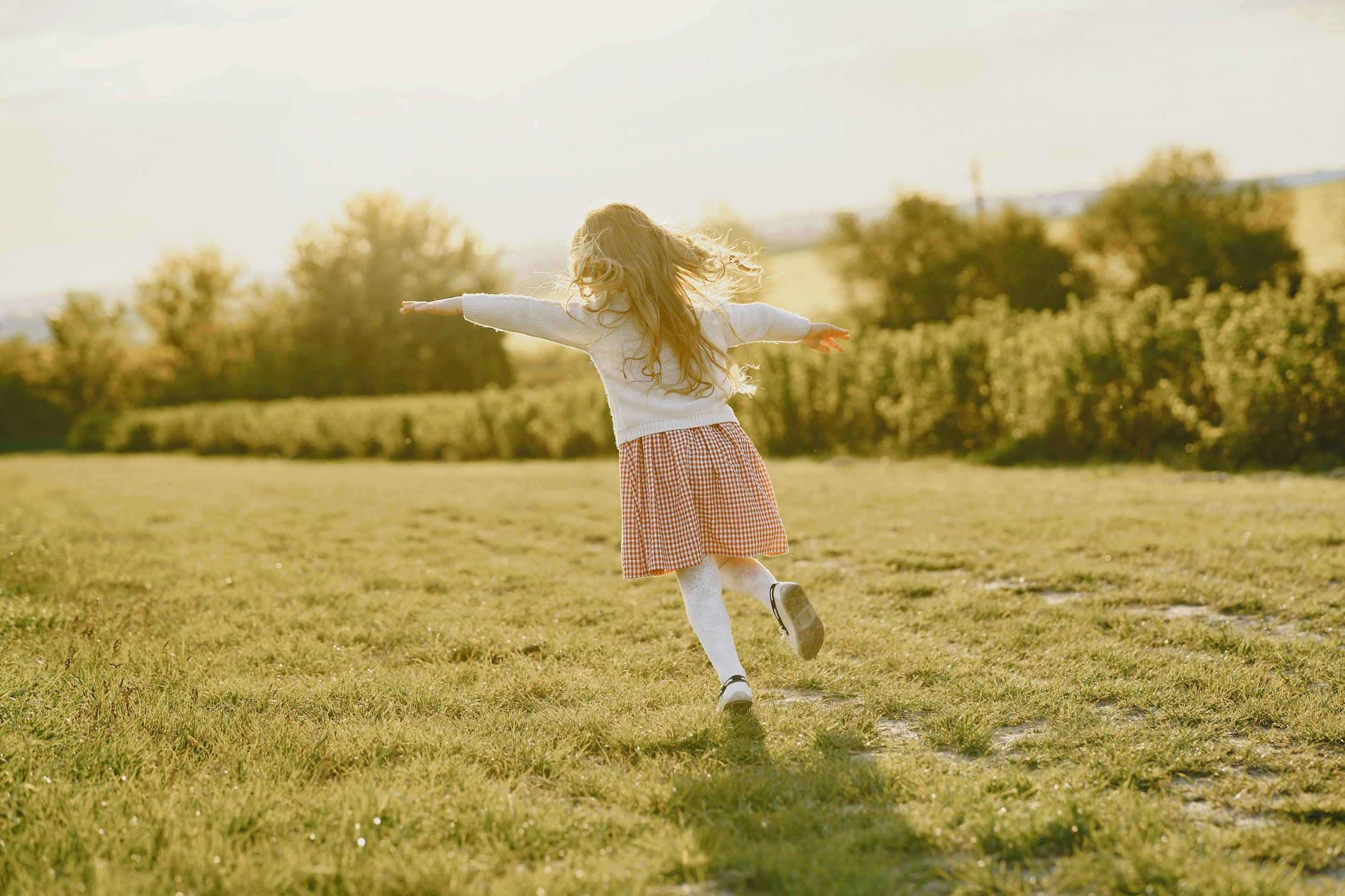 child playing in field.jpg
