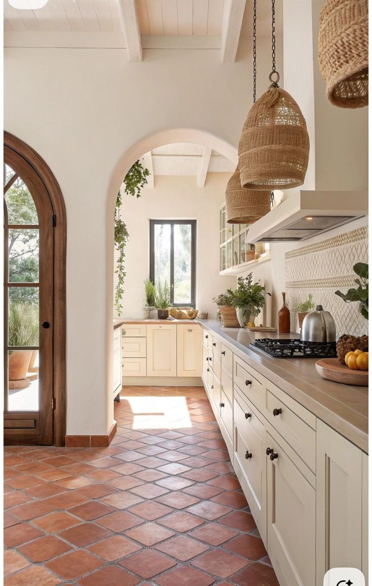 terracotta tile floor modern Mediterranean kitchen honed travertine island