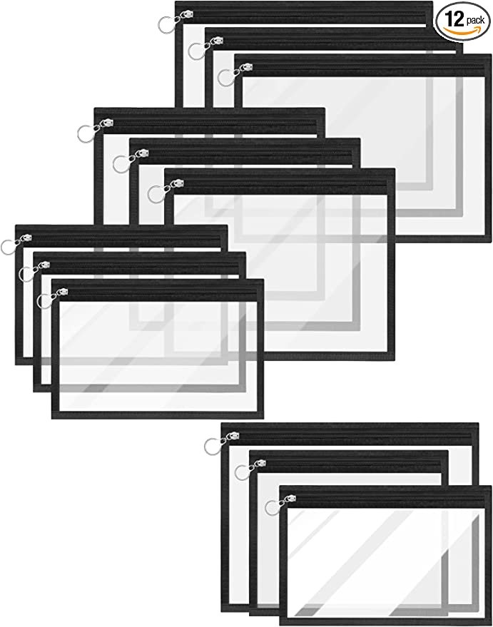 A set of 12 clear plastic zippered storage bags with black trim, varying in size, stacked in two groups.