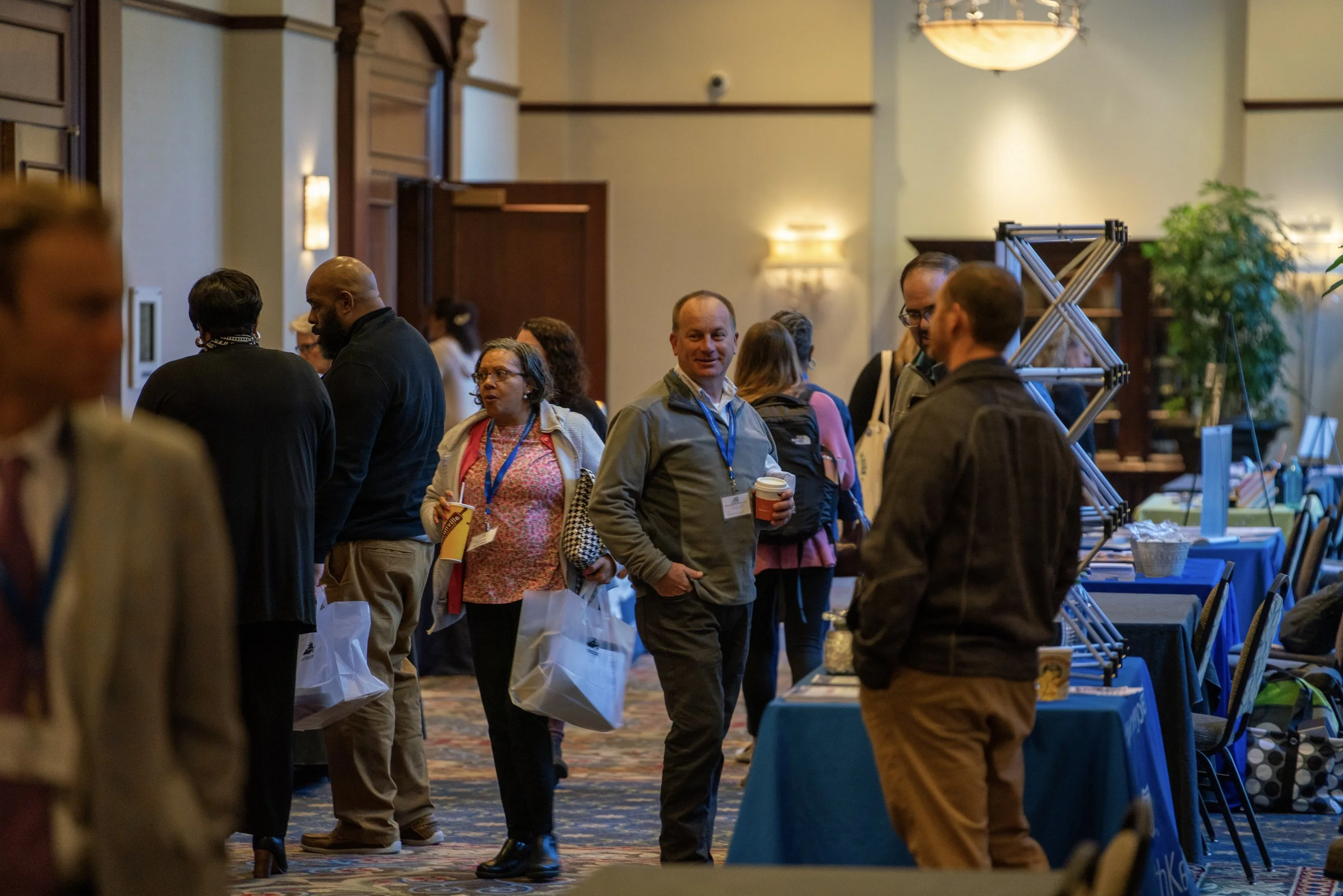 Conference attendees networking during a break