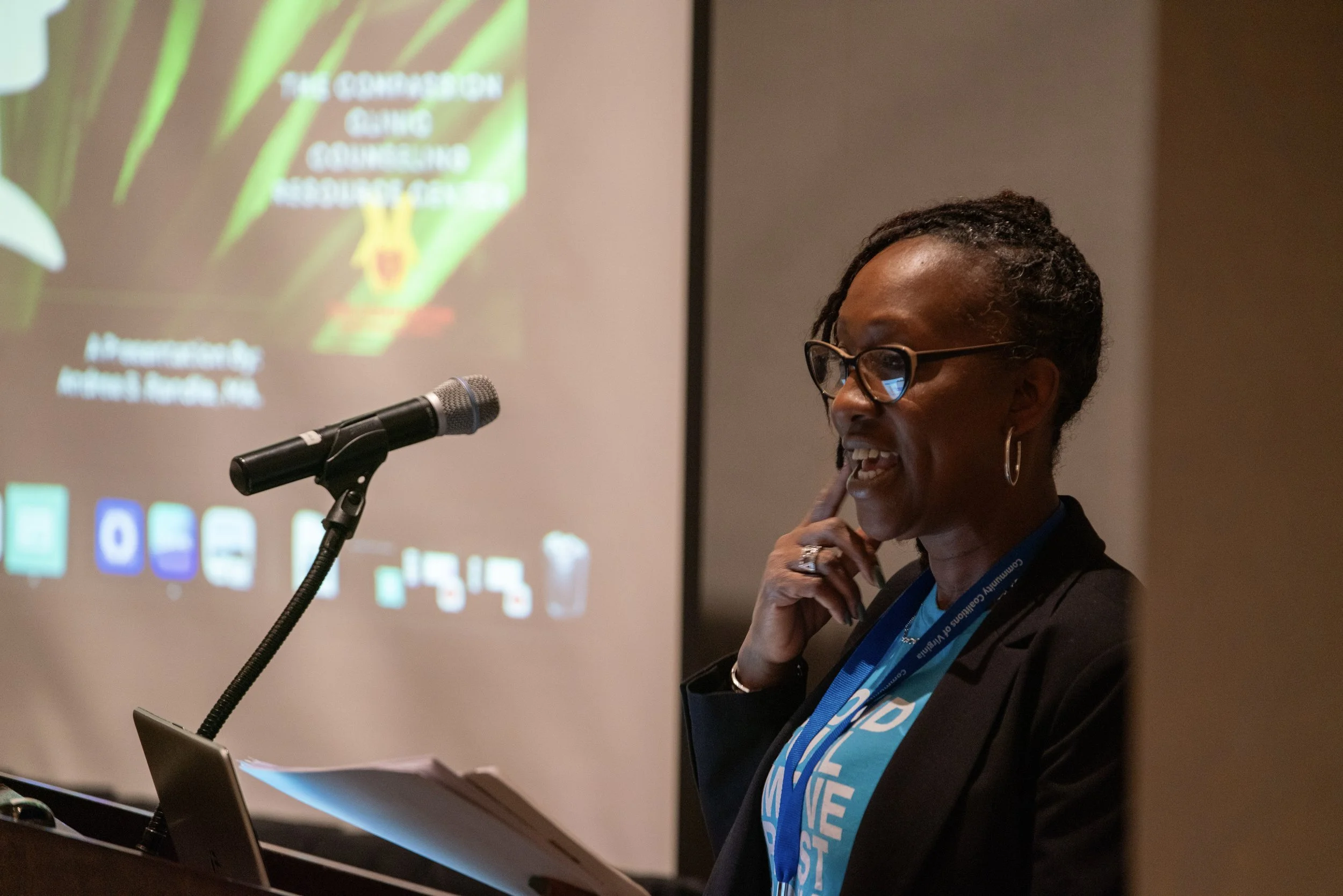 Female presenter speaking at a lectern