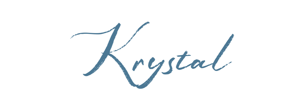 The word 'Krystal' written in elegant script font with a crystal-like design element above it.