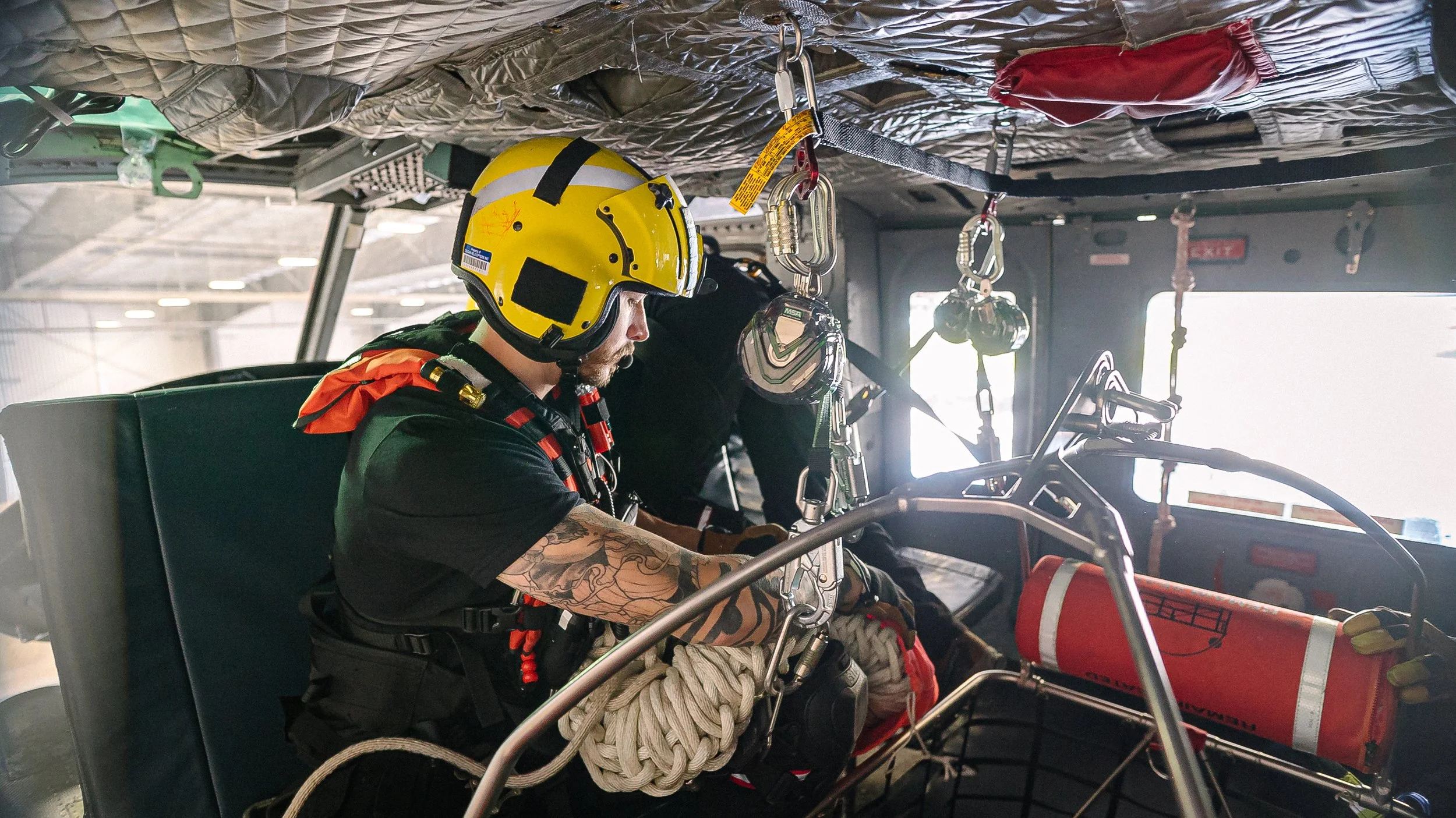 Medevac team member in helicopter.
