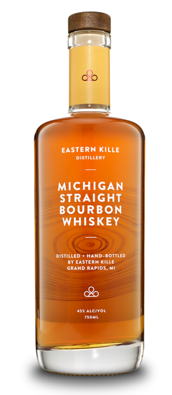 A bottle of Eastern Kille Michigan Straight Bourbon Whiskey with an amber liquid inside, a tan label, and a wooden cap.