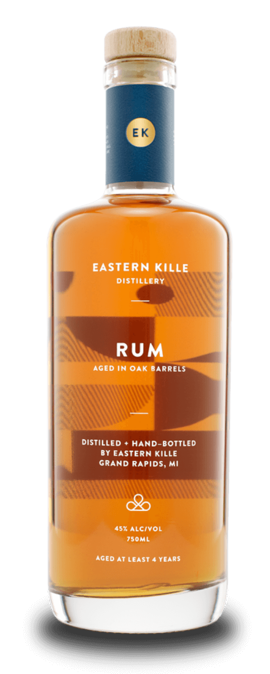 Bottle of Eastern Kille Rum with a wooden cap, labeled as aged in oak barrels, with 45% alcohol, 750ml, aged at least four years, in Grand Rapids, Michigan.