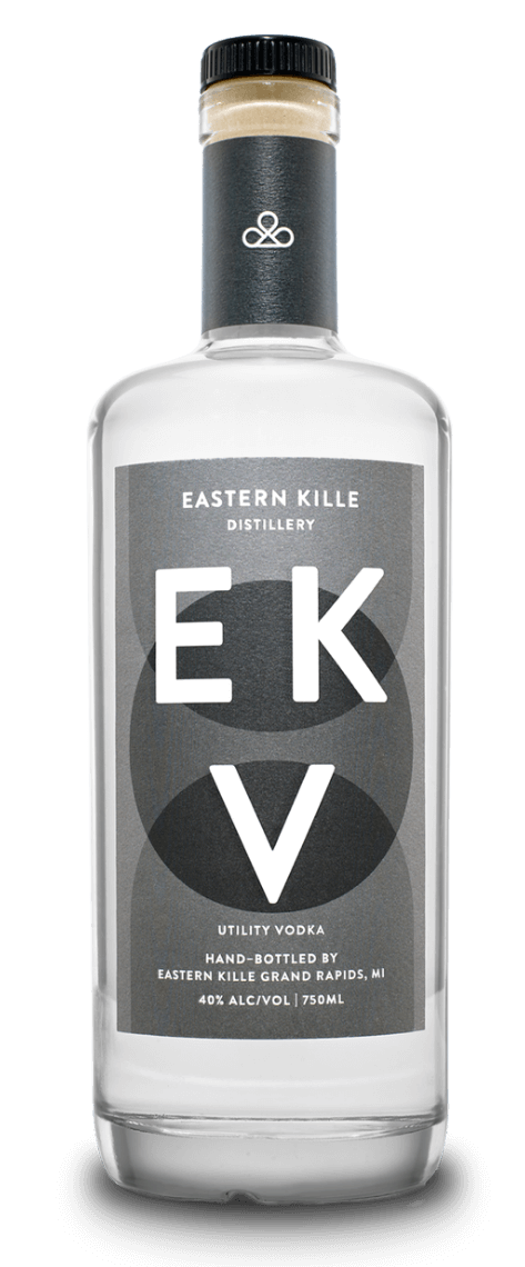 A clear glass bottle of EKV Utility Vodka from Eastern Kille Distillery, with a black cap and gray label.
