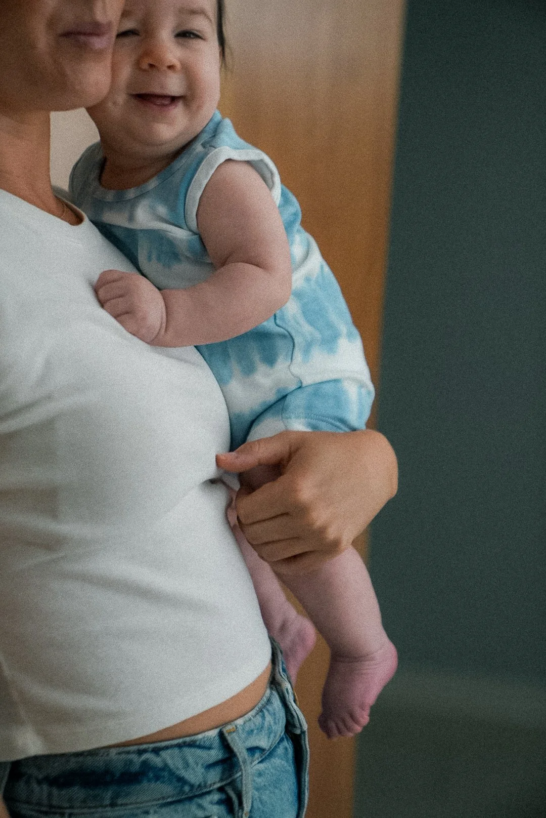 Dr. Madison Smith sharing a moment with a baby during a chiropractic session in Dallas, Tx.