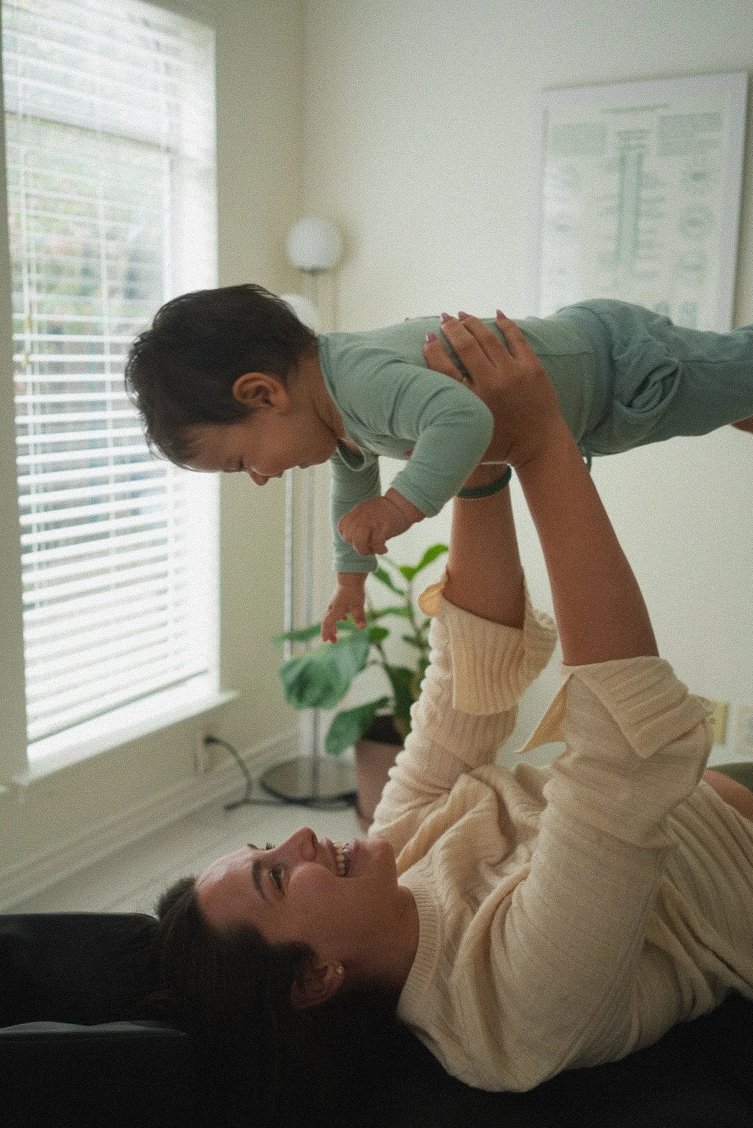 A mother and her baby enjoying their session at Intuitive Heart.