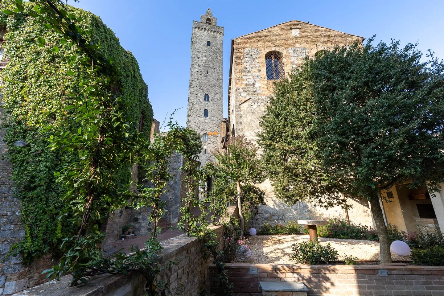 Private outdoor area at Casa Costarella with view toward San Gimignano towers