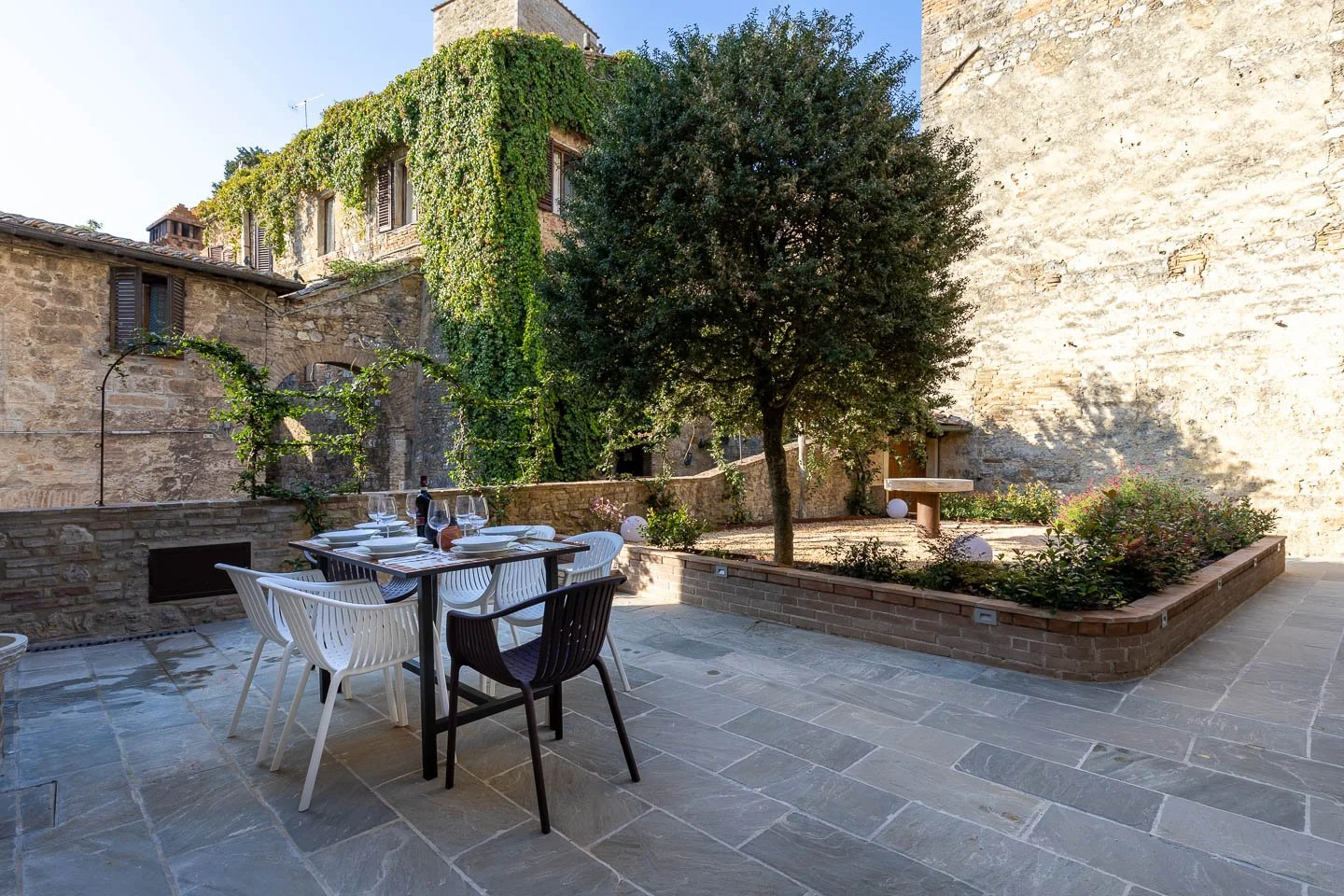 Private outdoor patio for dining in a premium holiday apartment in San Gimignano old town