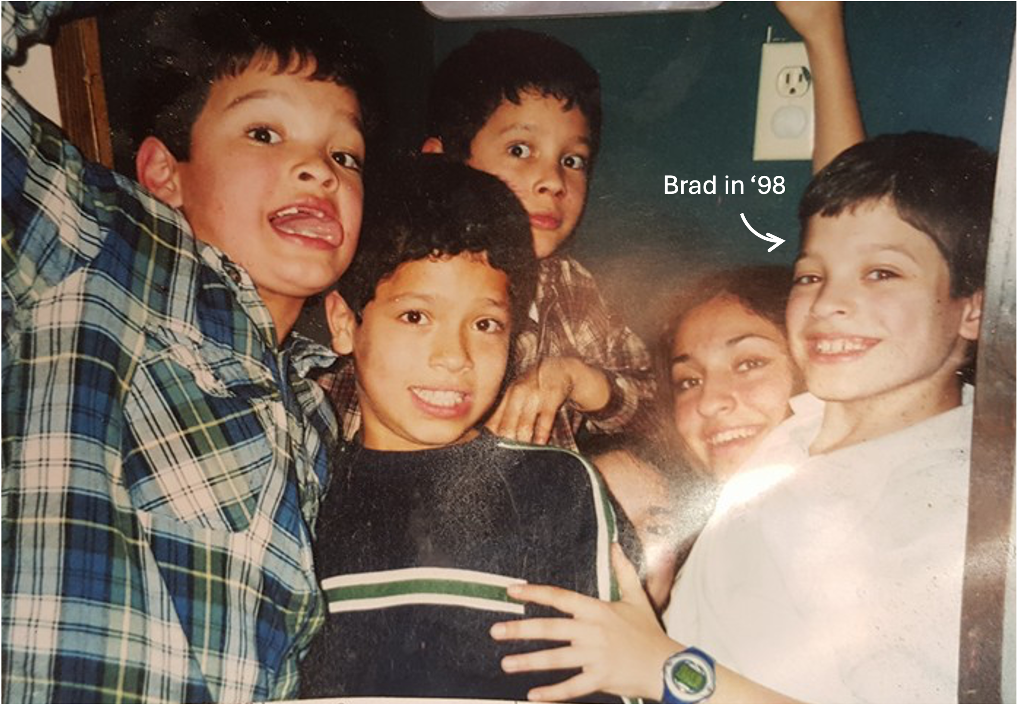 An old picture of six children, four boys and two girls.