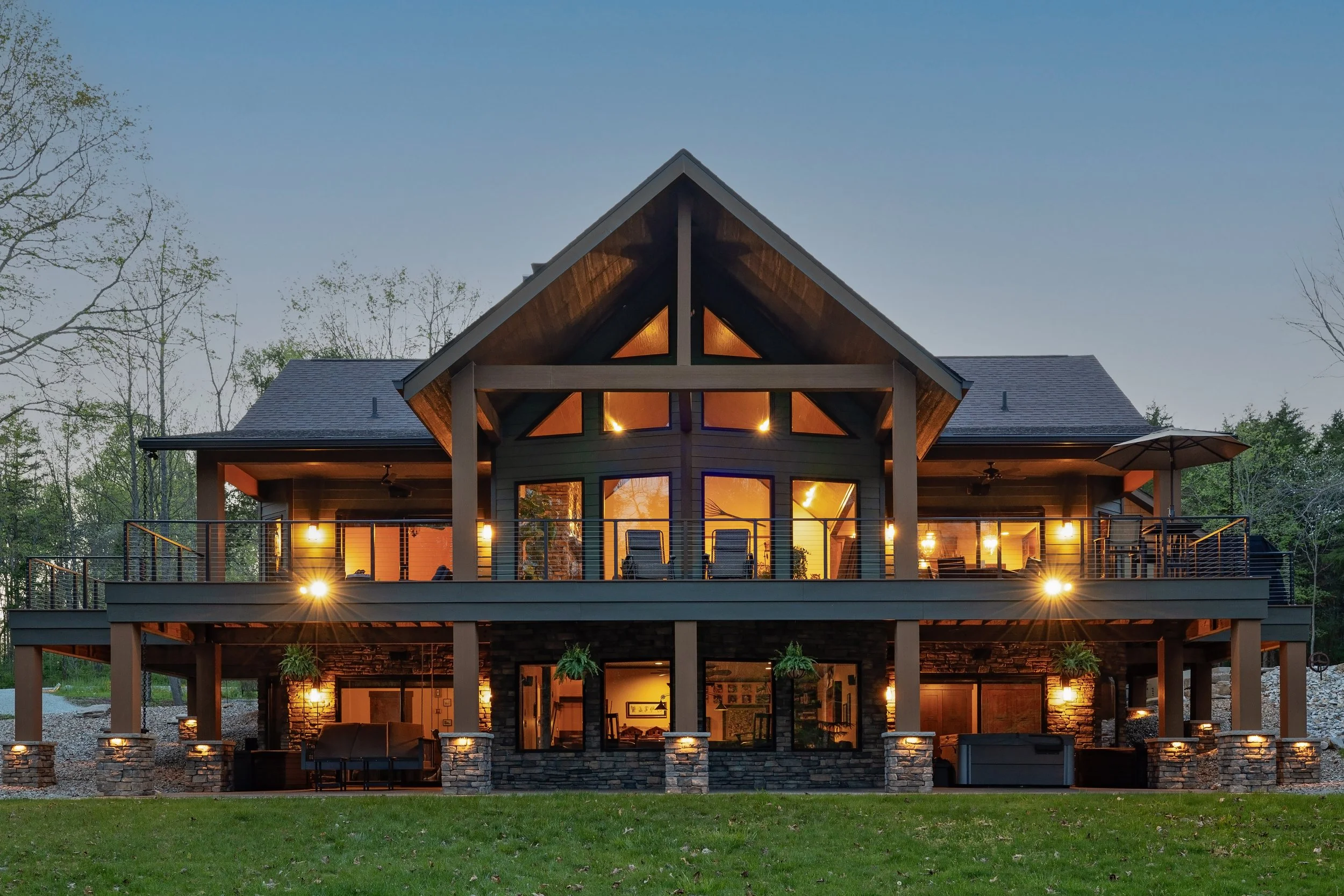 Home at twilight with lots of windows